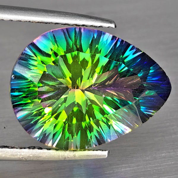 Natural Mystic Green Quartz Gemstones 8.05 Ct. Pear Concave Cut 16.1 x 12.2 Mm.: Product ID: 805513322 Product Name: Natural Topaz Weight: 8.05 CT. Size: 16.1 x 12.2 x 8.1 MM. Shape: Pear Concave Cut Color: Mystic Green Clarity:VVS Luster: Good Gems Origin: Brazil Treatment: Treat