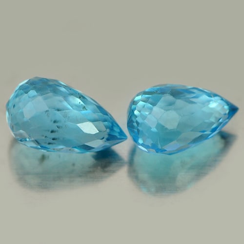 Natural Blue Topaz Gemstones 2.13 Ct. Pair Briolette Shape 7.8 x 4.7 Mm.: Product ID: 807151170 Product Name: Natural Blue Topaz Weight: 2.13 CT. Size: 7.8 x 4.7 x 4.7 MM. Shape: Briolette Color: Blue Clarity:VSI Luster: Good Gems Origin: Brazil Treatment: Treated Crystal S