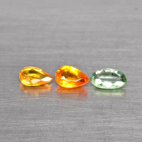 Natural Fancy Color Sapphire Gemstones 0.71 Ct. 3 Pcs. Mixed Shape and Mixed Size: Product ID: 806130628 Product Name: Natural Green Sapphire Weight: 0.71 CT. Size: 5.2 x 3.2 x 2 to 4.9 x 3.2 x 2.3 MM. Shape: Mixed Shape Color: Fancy Color Clarity:SI Luster: Good Gems Origin: Tanzan
