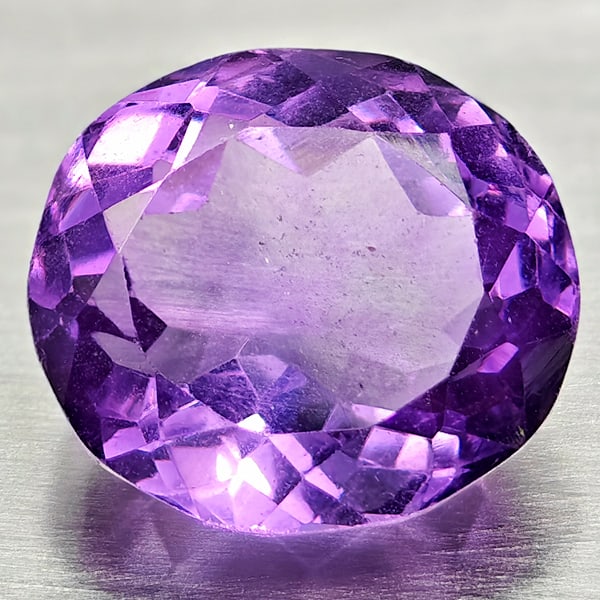 Natural Purple Amethyst Gemstones 6.68 Ct. Oval Shape 12.2 x 10.9 Mm.: Product ID: 800325406 Product Name: Natural Amethyst Weight: 6.68 CT. Size: 12.2 x 10.9 x 8 MM. Shape: Oval Color: Purple Clarity:VVS - VSI Luster: Good Gems Origin: Brazil Treatment: Unheated Crystal