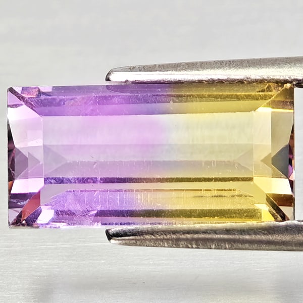 Natural Bi Color Ametrine Gemstones 2.96 Ct. Octagon Shape 12.2 x 6.2 Mm.: Product ID: 800408315 Product Name: Natural Ametrine Weight: 2.96 CT. Size: 12.2 x 6.2 x 4.8 MM. Shape: Octagon Color: Bi Color Clarity:VSI - SI1 Luster: Good Gems Origin: Bolivia Treatment: Unheated 