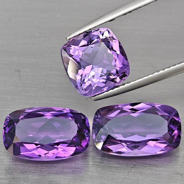 Natural Purple Amethyst Gemstones 11.91 Ct. 3 Pcs. Cushion Shape 13.2 x 8.3 Mm.: Product ID: 800325615 Product Name: Natural Amethyst Weight: 11.91 CT. Size: 13.2 x 8.3 x 6 to 9.5 x 9.5 x 7.1 MM. Shape: Cushion Shape Color: Purple Clarity:VSI Luster: Good Gems Origin: Brazil Treat