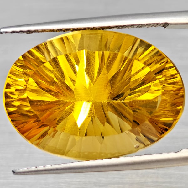 Natural Yellow Citrine Gemstones 14.04 Ct. Oval Concave Cut 20 x 14.5 Mm.: Product ID: 801815407 Product Name: Natural Citrine Weight: 14.04 CT. Size: 20 x 14.5 x 10.7 MM. Shape: Oval Concave Color: Yellow Clarity:VSI Luster: Good Gems Origin: Brazil Treatment: Unheated Crys