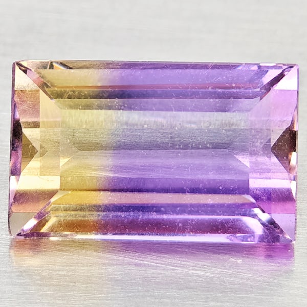 Natural Bi Color Ametrine Gemstones1.73 Ct. Baguette Shape 9 x 5.7 Mm.: Product ID: 800408530 Product Name: Natural Ametrine Weight: 1.73 CT. Size: 9 x 5.7 x 4.3 MM. Shape: Baguette Color: Bi Color Clarity:VSI Luster: Good Gems Origin: Bolivia Treatment: Unheated Crystal 