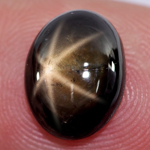Natural Black Star Sapphire Gemstones 3.75 Ct. Oval Cabochon Shape 10.8 x 8.3 Mm.: Product ID: 806132950 Product Name: Natural Star Sapphire Weight: 3.75 CT. Size: 10.8 x 8.3 x 3.7 MM. Shape: Oval Cabochon Color: Black Clarity:Opaque Luster: Good 6 Rays Star Gems Origin: Thailand Tr