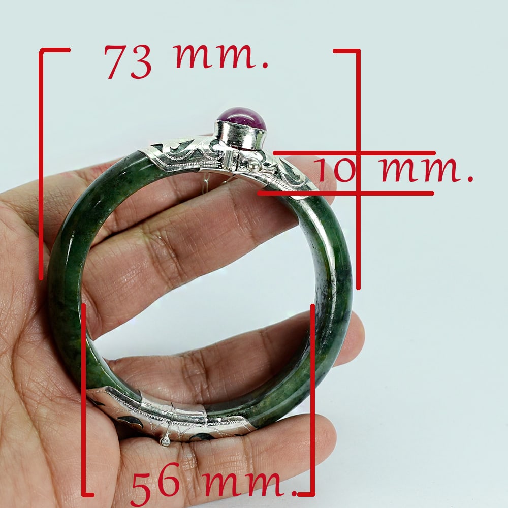 Natural Green Jade Bangle 328.58 Ct. Diameter 56 Mm. With Silver Jewelry & Ruby Gemstones: Product ID: 818102471 Product Name: Natural Gemstones Weight: 328.58 CT. Size: 73 x 56 x 10 MM. Shape: None Color: Green Clarity:Opaque Luster: Good Gems Origin: Burma Treatment: Unheated Crystal Stru