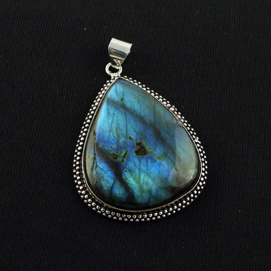 Natural Labradorite Sterling Silver Plated Handmade Pendant: Product ID: 260818143923 Product - Handmade Silver Plated Pendant Metal - 92.5 Sterling Silver Plated Gemstone - Labradorite Gemstone Origin - Canada Gemstone Shape - Pear Gemstone Size - 4.5X3.5 CM P