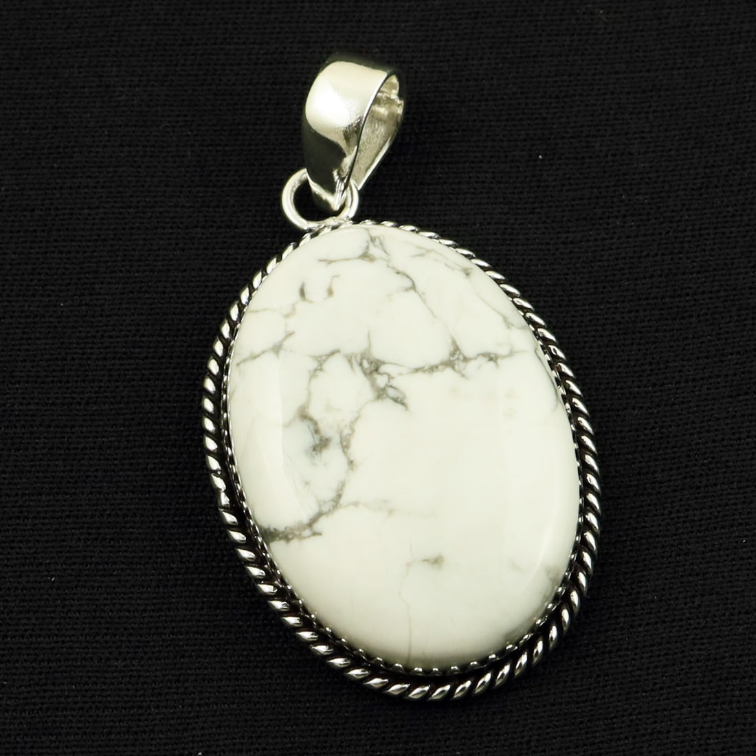 Natural Howlite Sterling Silver Plated Handmade Pendant: Product ID: 260714160429 Product - Handmade Silver Plated Pendant Metal - 92.5 Sterling Silver Plated Pendant Size - 3.5x2.5 CM Gemstone - Howlite Gemstone Origin - Canada Gemstone Shape - Oval Pendan