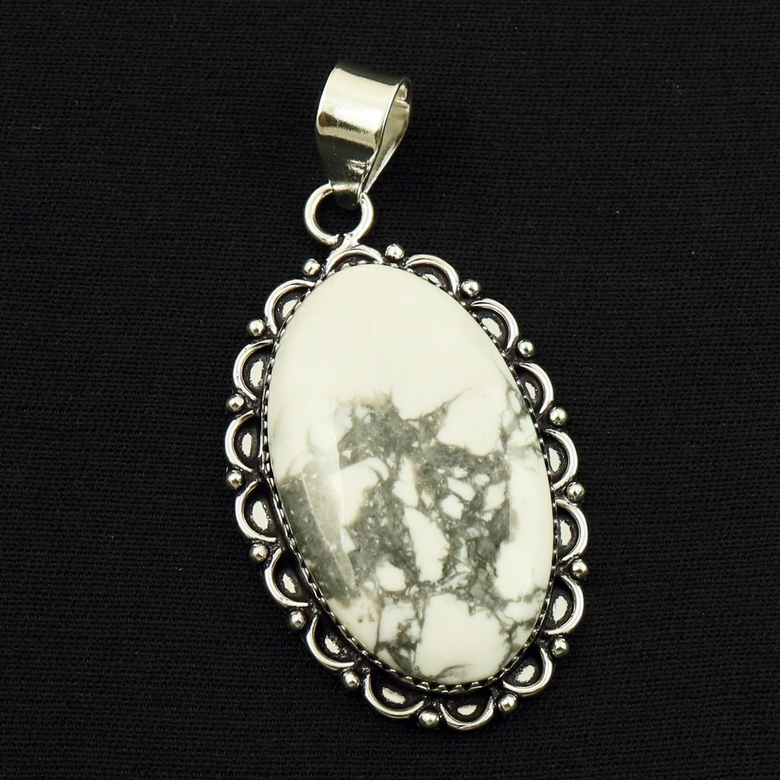 Natural Howlite Sterling Silver Plated Handmade Pendant: Product ID: 260714160157 Product - Handmade Silver Plated Pendant Metal - 92.5 Sterling Silver Plated Pendant Size - 4x2.5 CM Gemstone - Howlite Gemstone Origin - Canada Gemstone Shape - Oval Pendant 