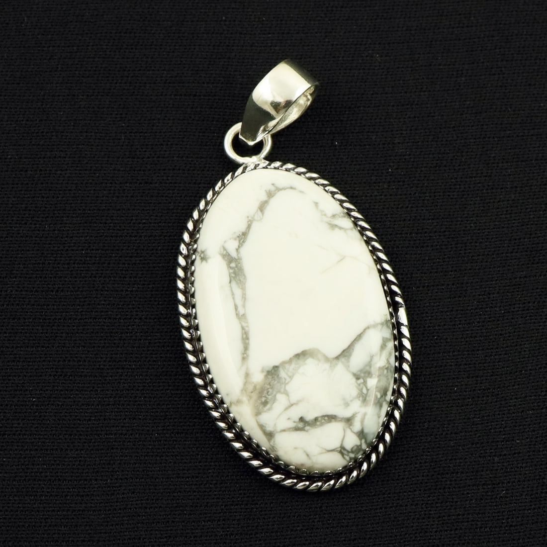 Natural Howlite Sterling Silver Plated Handmade Pendant: Product ID: 260714160003 Product - Handmade Silver Plated Pendant Metal - 92.5 Sterling Silver Plated Pendant Size - 4x2.5 CM Gemstone - Howlite Gemstone Origin - Canada Gemstone Shape - Oval Pendant 