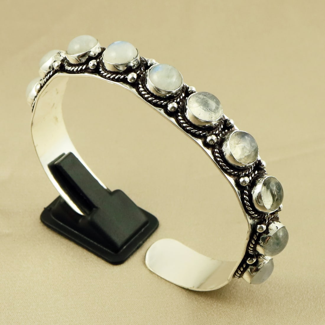 Natural 8MM Rainbow Moonstone Sterling Silver Plated Handmade Cuff Bangle: Product ID: 260709171756 Product - Handmade Silver Plated Cuff Bangle Metal - 92.5 Sterling Silver Plated Bangle Size - 6.5x5.5 CM (Adjustable) Gemstone - Rainbow Moonstone Gemstone Origin - India Gem