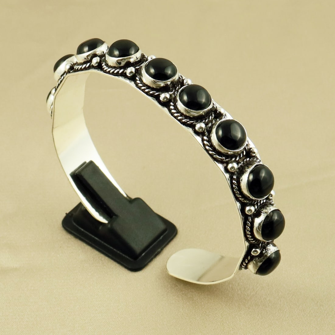 Natural 8MM Black Onyx Sterling Silver Plated Handmade Cuff Bangle: Product ID: 260709170623 Product - Handmade Silver Plated Cuff Bangle Metal - 92.5 Sterling Silver Plated Bangle Size - 6.5x5.5 CM (Adjustable) Gemstone - Black Onyx Gemstone Origin - India Gemstone S