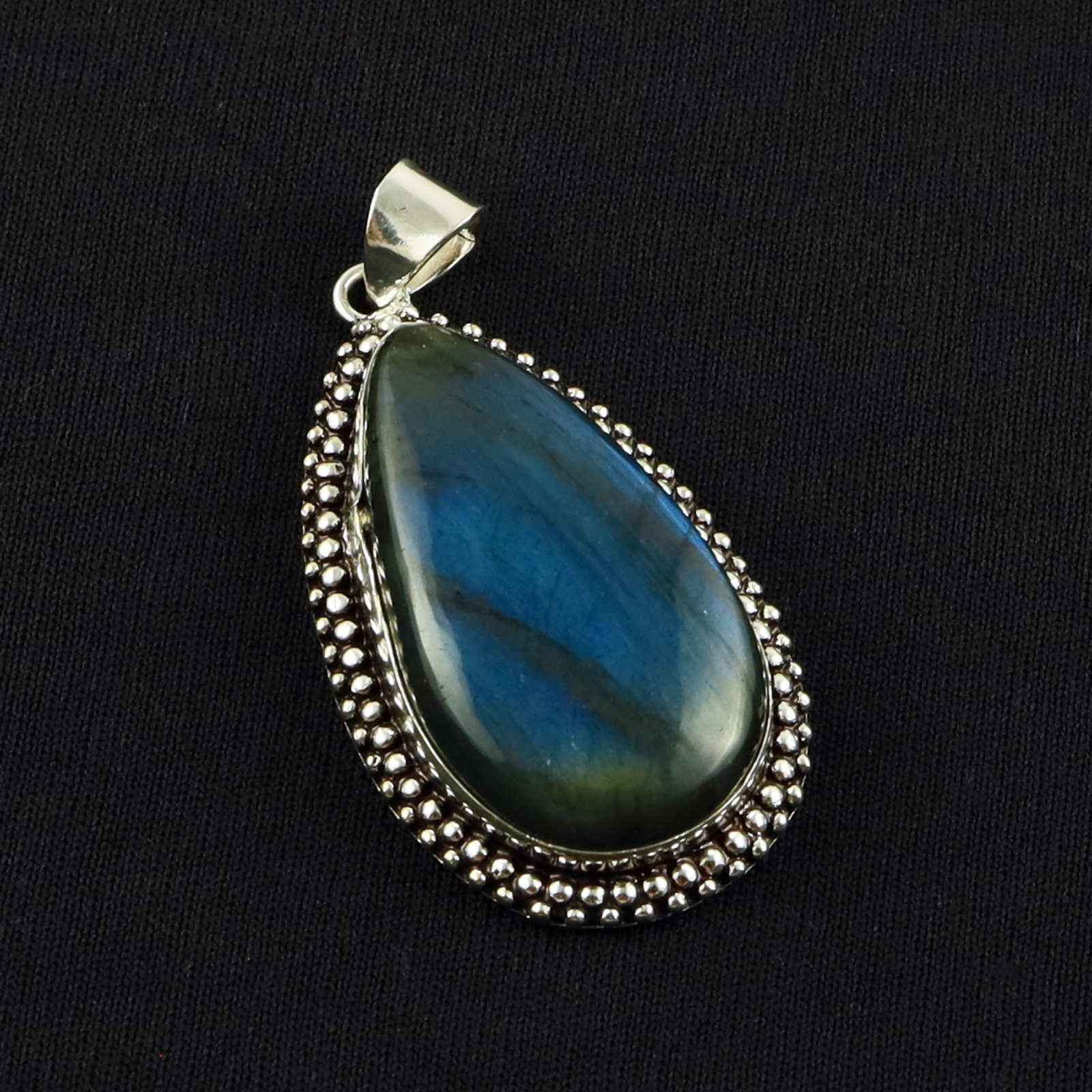 Natural Labradorite Sterling Silver Plated Handmade Pendant: Product ID: 260701135238 Product - Handmade Silver Plated Pendant Metal - 92.5 Sterling Silver Plated Pendant Size - 4.5x2 CM Gemstone - Labradorite Gemstone Origin - Canada Gemstone Shape - Pear Pend