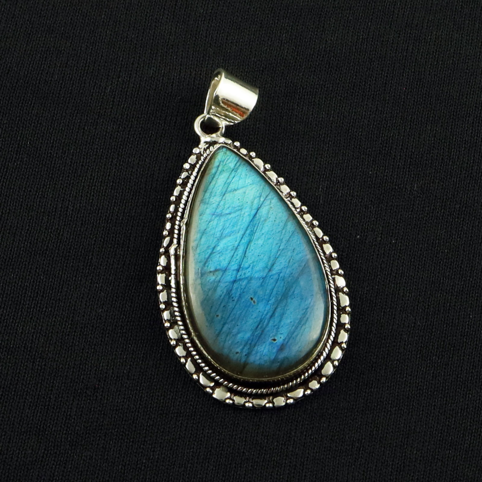 Natural Labradorite Sterling Silver Plated Handmade Pendant: Product ID: 260701135138 Product - Handmade Silver Plated Pendant Metal - 92.5 Sterling Silver Plated Pendant Size - 4x2 CM Gemstone - Labradorite Gemstone Origin - Canada Gemstone Shape - Pear Pendan