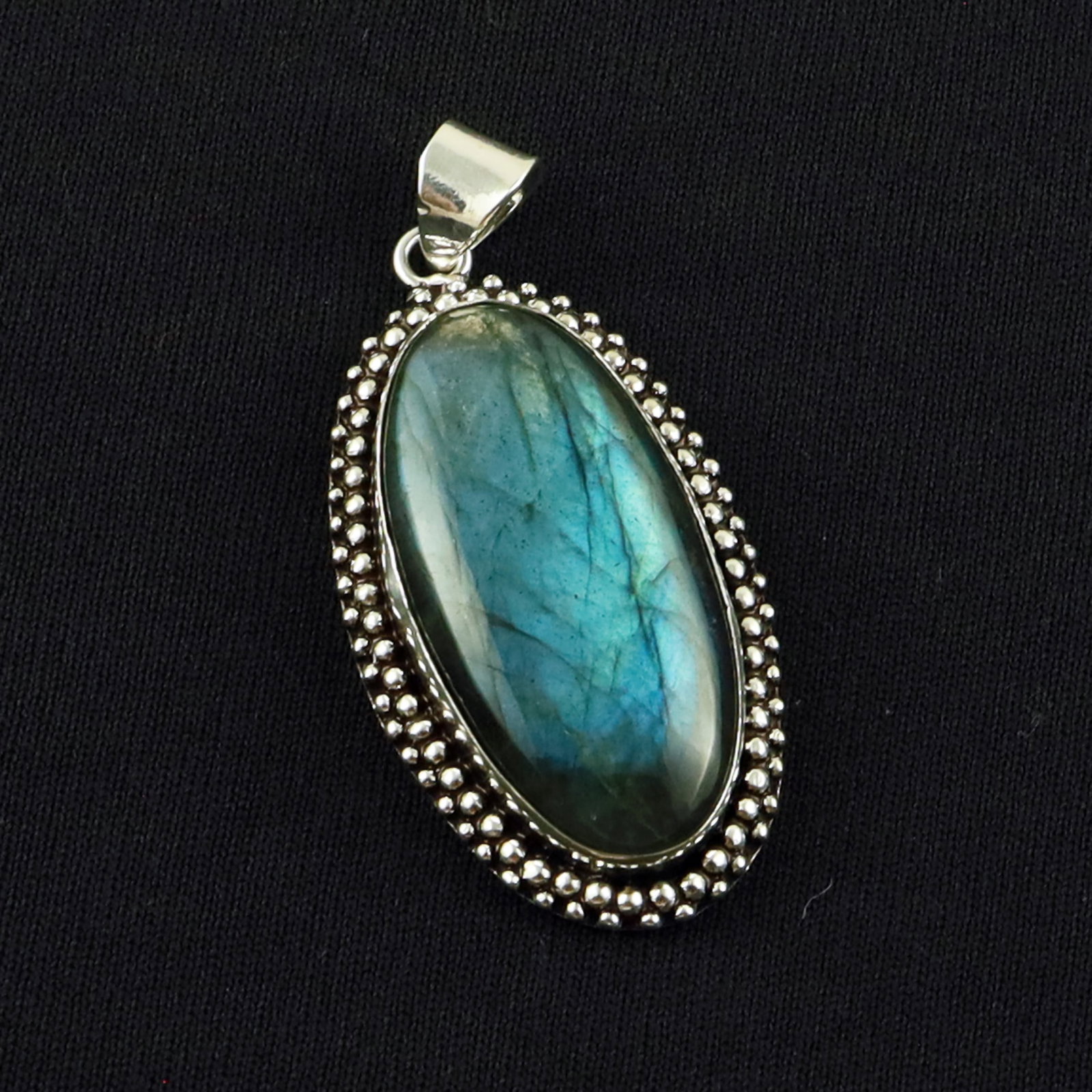 Natural Labradorite Sterling Silver Plated Handmade Pendant: Product ID: 260701134958 Product - Handmade Silver Plated Pendant Metal - 92.5 Sterling Silver Plated Pendant Size - 4x2 CM Gemstone - Labradorite Gemstone Origin - Canada Gemstone Shape - Oval Pendan
