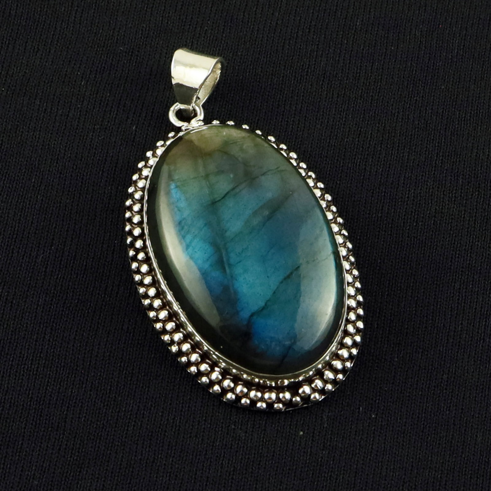 Natural Labradorite Sterling Silver Plated Handmade Pendant: Product ID: 260701134651 Product - Handmade Silver Plated Pendant Metal - 92.5 Sterling Silver Plated Pendant Size - 4.5x2.5 CM Gemstone - Labradorite Gemstone Origin - Canada Gemstone Shape - Oval Pe