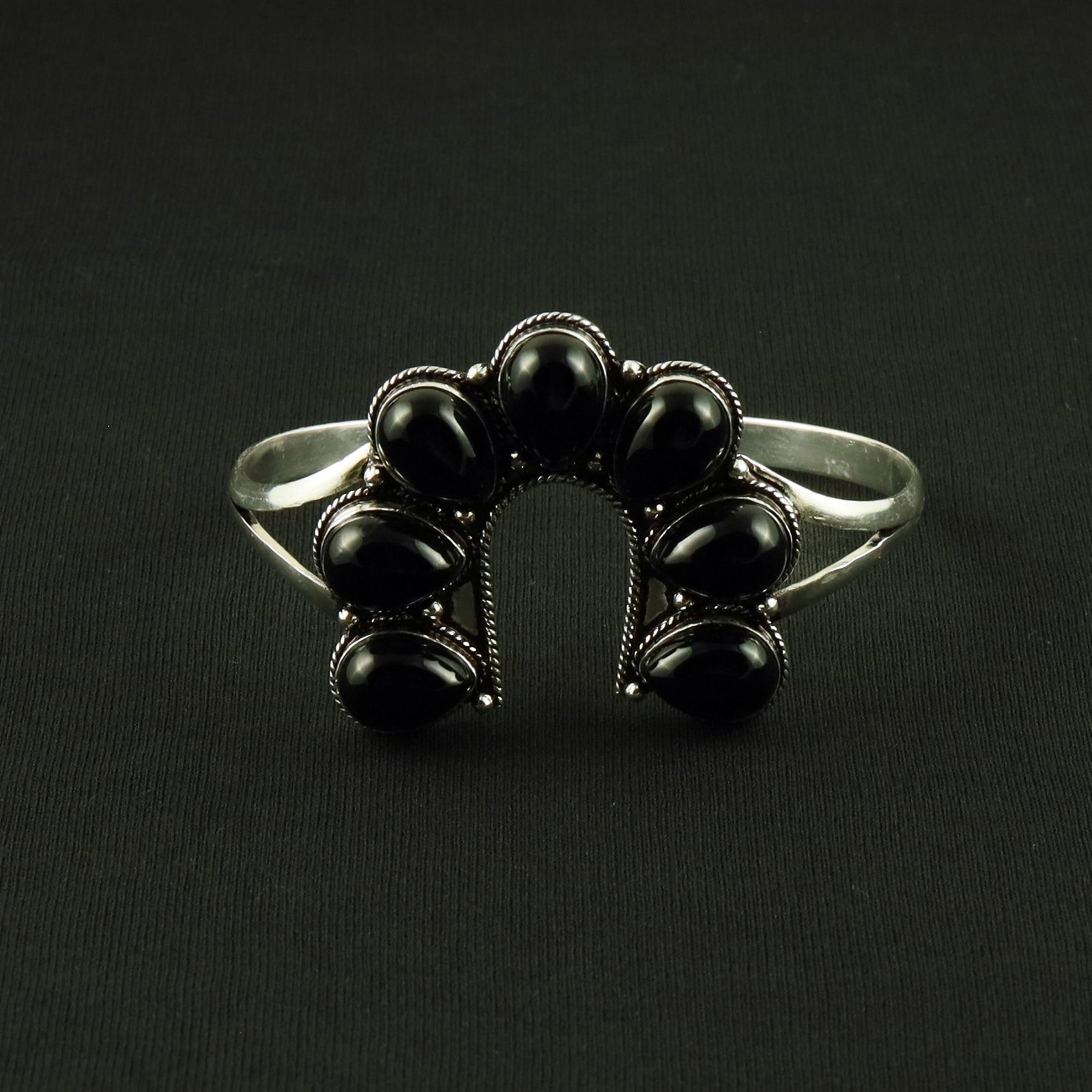 Natural Black Onyx Sterling Silver Plated Handmade Cuff Bangle: Product ID: 260617120101 Product - Handmade Silver Plated Cuff Bangle Metal - 92.5 Sterling Silver Plated Bangle Size - 7.5x5 CM (Adjustable) Gemstone - Black Onyx Gemstone Origin - India Gemstone Siz