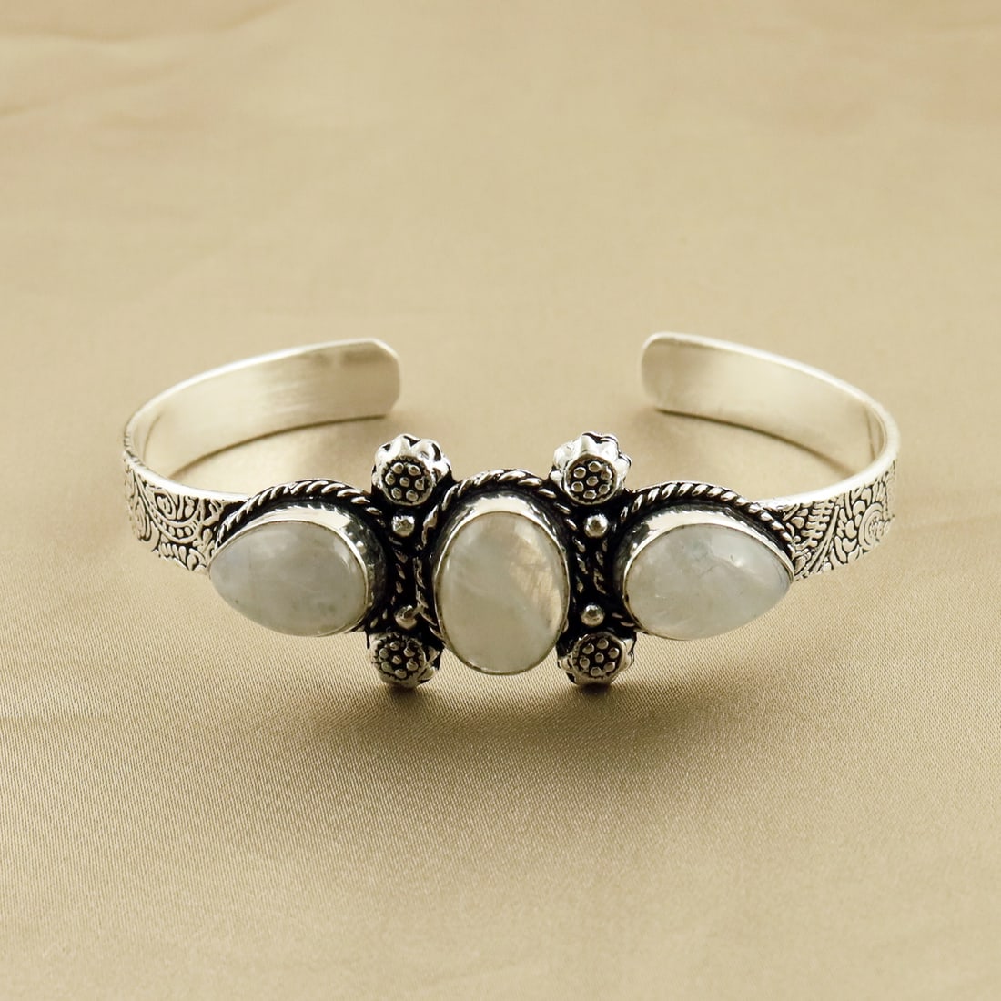 Natural Rainbow Moonstone Sterling Silver Plated Handmade Cuff Bangle: Product ID: 260807165006 Product - Handmade Silver Plated Cuff Bangle Metal - 92.5 Sterling Silver Plated Bangle Size - 7x5 CM (Adjustable) Gemstone - Rainbow Moonstone Gemstone Origin - India Gemston