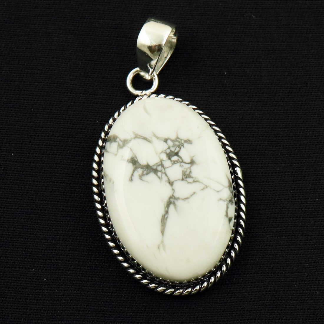 Natural Howlite Sterling Silver Plated Handmade Pendant: Product ID: 260714161050 Product - Handmade Silver Plated Pendant Metal - 92.5 Sterling Silver Plated Pendant Size - 3.5x2.5 CM Gemstone - Howlite Gemstone Origin - Canada Gemstone Shape - Oval Pendan