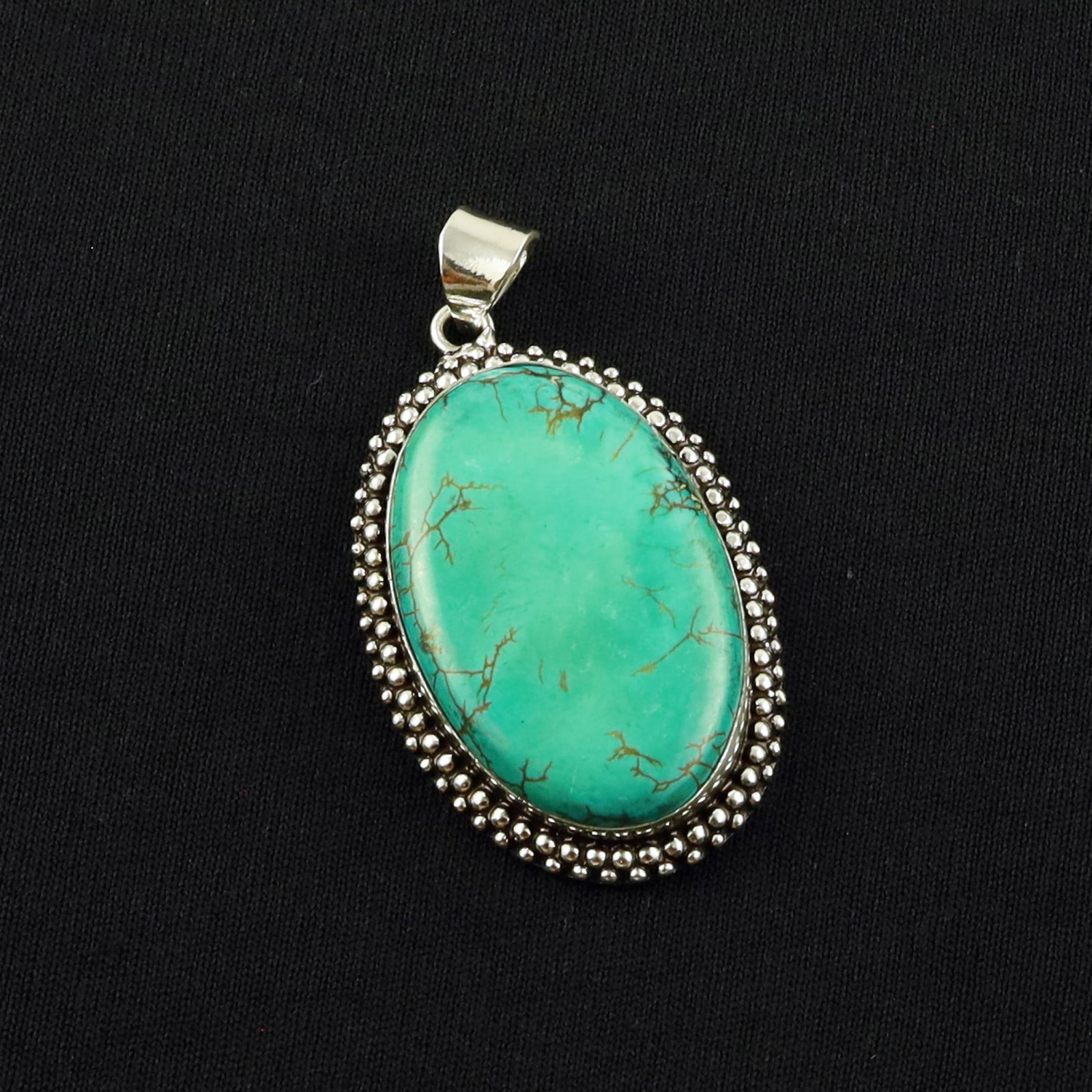 Natural Turquoise Sterling Silver Plated Handmade Pendant: Product ID: 260701140423 Product - Handmade Silver Plated Pendant Metal - 92.5 Sterling Silver Plated Pendant Size - 4x2.5 CM Gemstone - Turquoise Gemstone Origin - Tibet Gemstone Shape - Oval Pendant