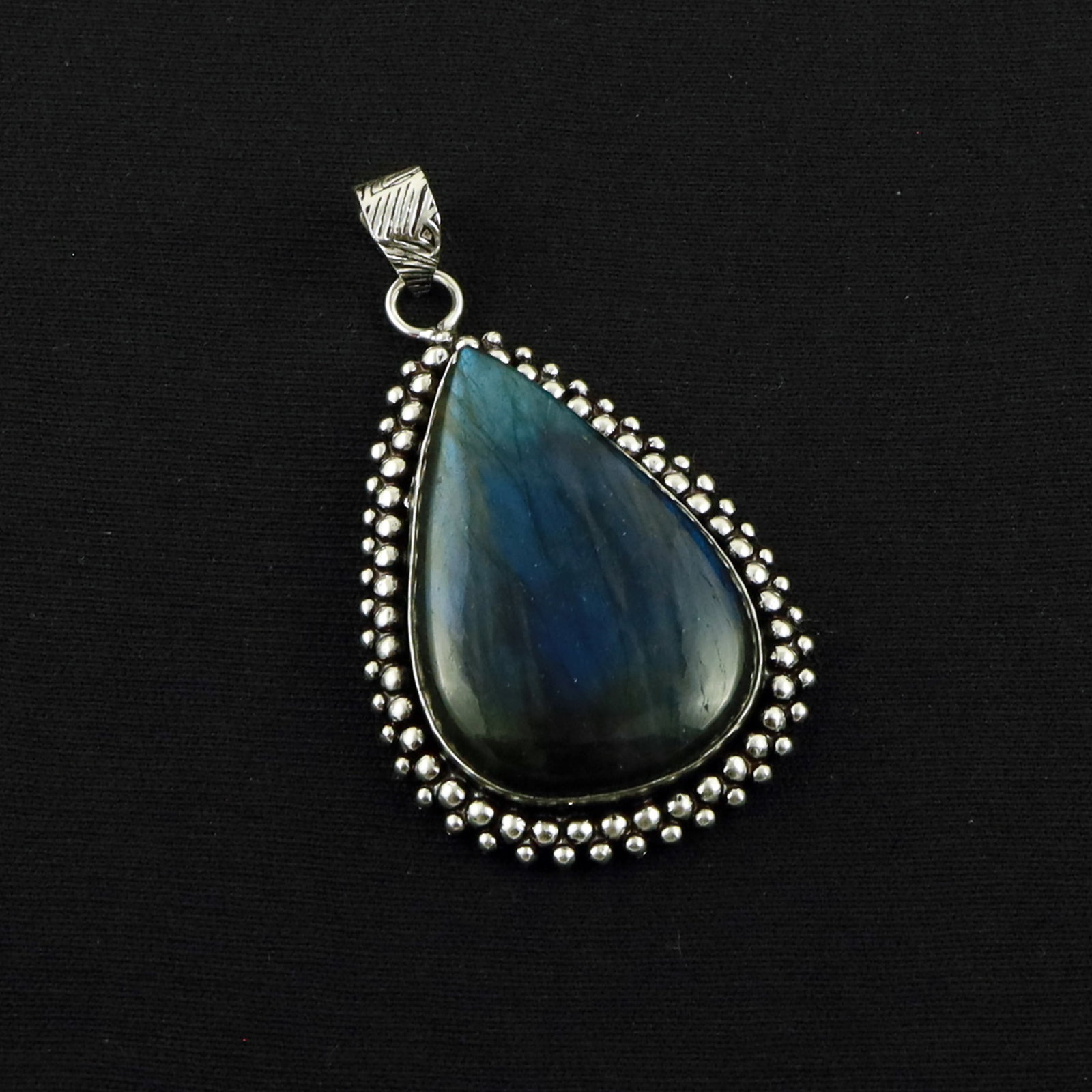 Natural Labradorite Sterling Silver Plated Handmade Pendant: Product ID: 260619172414 Product - Handmade Silver Plated Pendant Metal - 92.5 Sterling Silver Plated Pendant Size - 4X2.5 CM Gemstone - Labradorite Gemstone Origin - Canada Gemstone Shape - Pear Pend