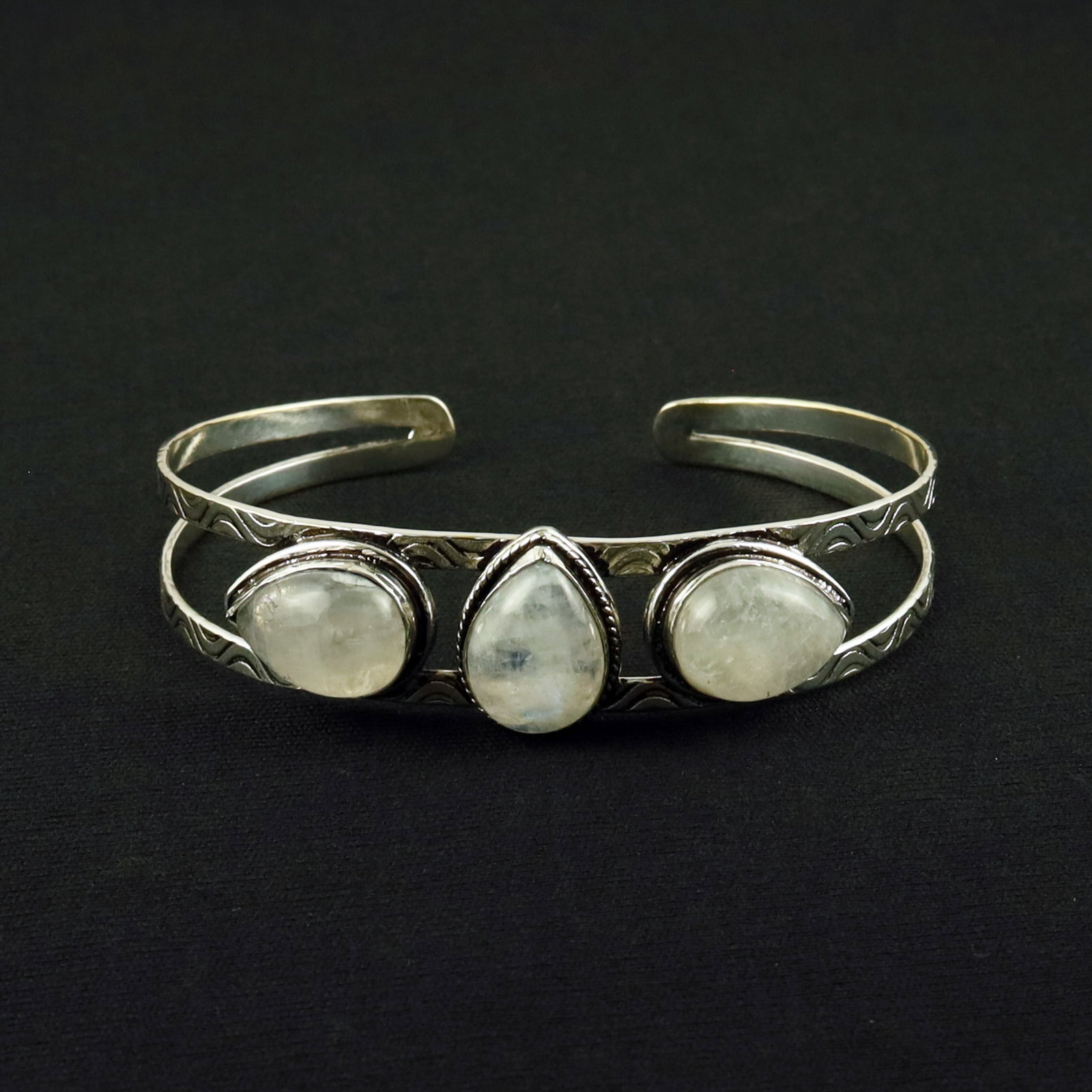 Natural Rainbow Moonstone Sterling Silver Plated Handmade Cuff Bangle: Product ID: 260612171253 Product - Handmade Silver Plated Cuff Bangle Metal - 92.5 Sterling Silver Plated Bangle Size - 7.5x5.5 CM (Adjustable) Gemstone - Rainbow Moonstone Gemstone Origin - India Gem