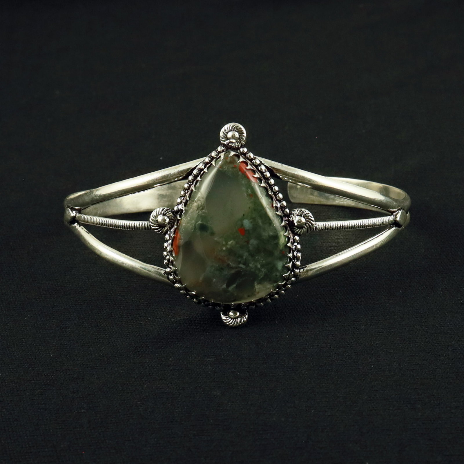 Natural Blood Stone Sterling Silver Plated Handmade Cuff Bangle: Product ID: 260611143812 Product - Handmade Silver Plated Cuff Bangle Metal - 92.5 Sterling Silver Plated Bangle Size - 7.5x5.5 CM (Adjustable) Gemstone - Blood Stone Gemstone Origin - India Gemstone 