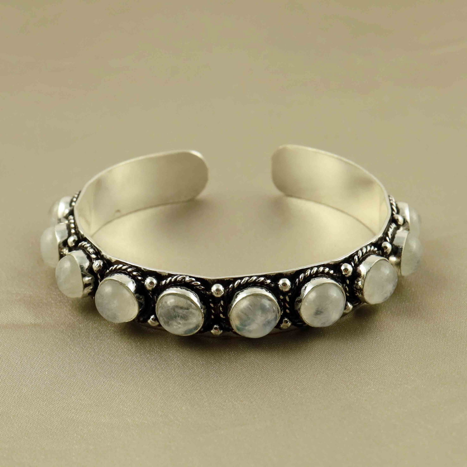 Natural Rainbow Moonstone Sterling Silver Plated Handmade Cuff Bangle: Product ID: 260607172753 Product - Handmade Silver Plated Cuff Bangle Metal - 92.5 Sterling Silver Plated Bangle Size - 6.5x5.5 CM (Adjustable) Gemstone - Rainbow Moonstone Gemstone Origin - India Gem