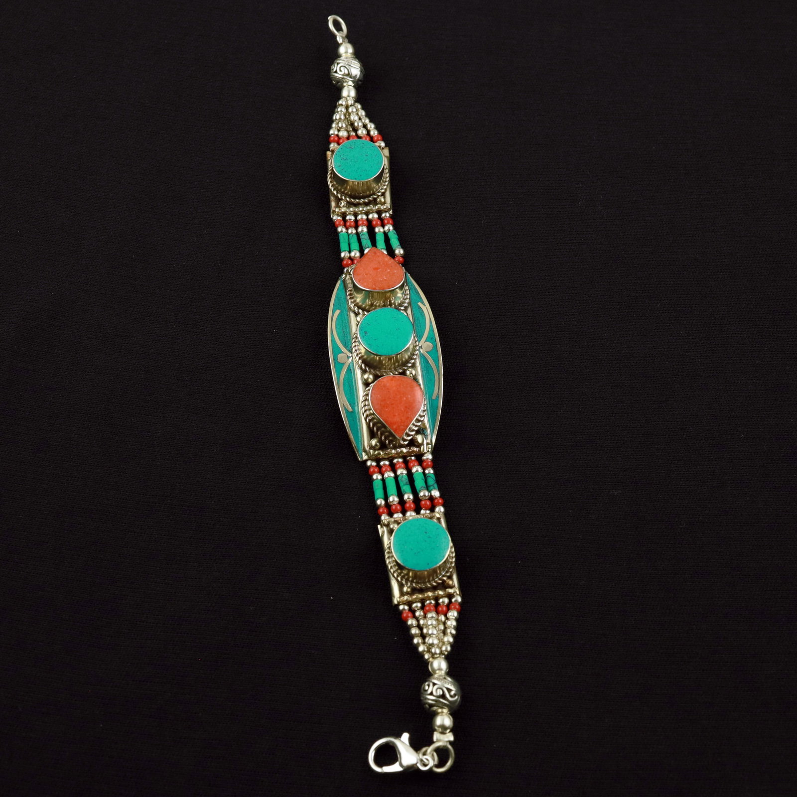 Tibetan Turquoise & Coral Handmade Designer Bracelet: Product ID: 260520114849 Product - Tibetan Handmade Ethnic Bracelet Gemstone - Natural Turquoise & Coral Size - 7 Inch Weight - 50 Gram Approx Metal - Brass & Copper mix Metal Origin - Nepal Country/R