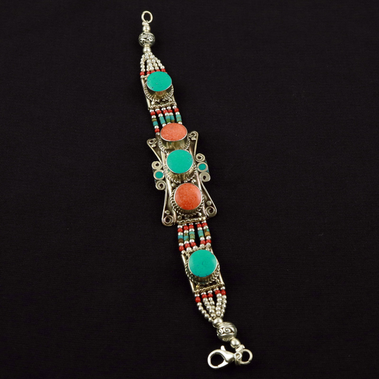 Tibetan Turquoise & Coral Handmade Ethnic Bold Bracelet: Product ID: 260520114620 Product - Tibetan Handmade Ethnic Bracelet Gemstone - Natural Turquoise & Coral Size - 7 Inch Weight - 50 Gram Approx Metal - Brass & Copper mix Metal Origin - Nepal Country/R