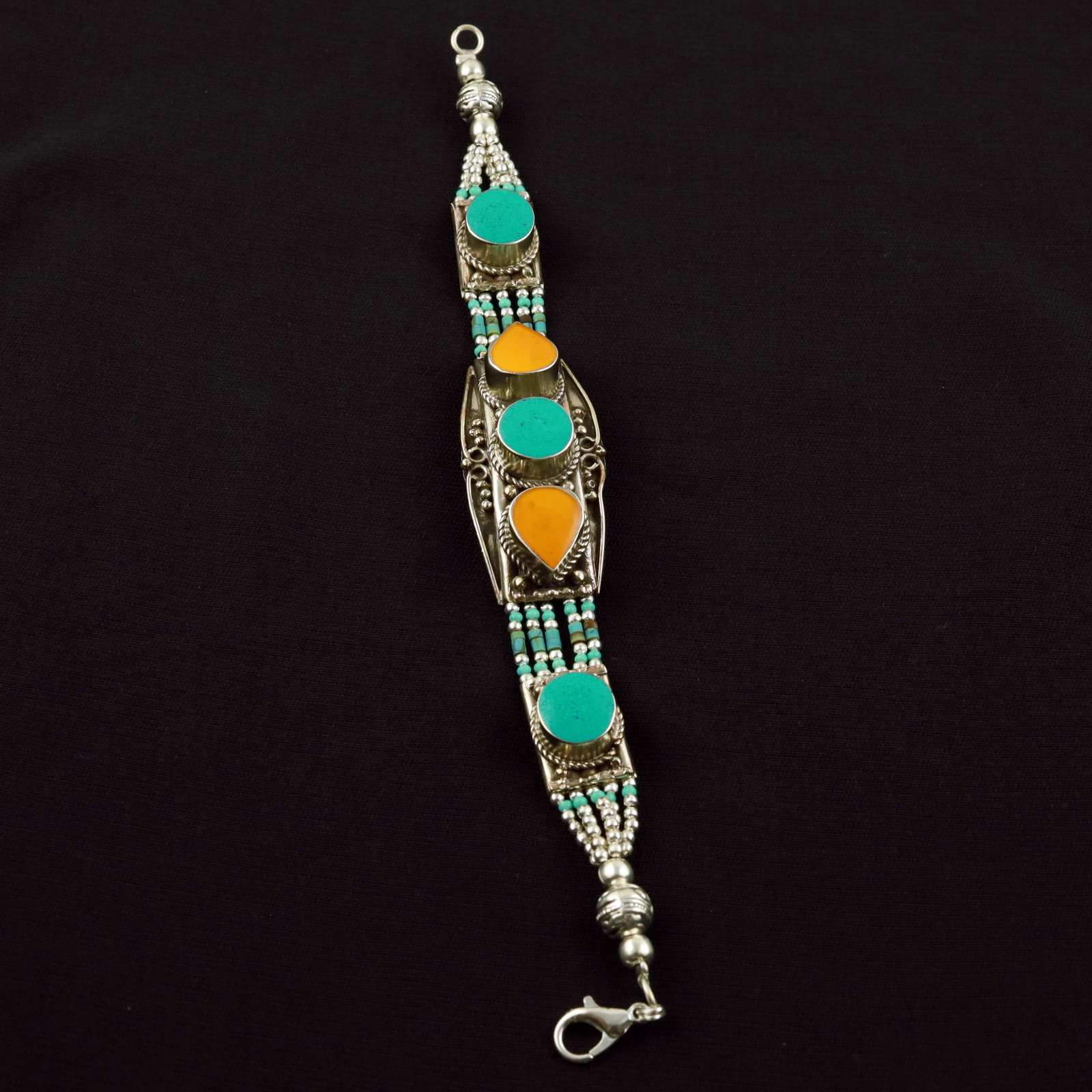 Tibetan Natural Turquoise & Copal Handmade Royal Bracelet: Product ID: 260520114310 Product - Tibetan Handmade Ethnic Bracelet Gemstone - Natural Turquoise & Copal Size - 7 Inch Weight - 50 Gram Approx Metal - Brass & Copper mix Metal Origin - Nepal Country/R