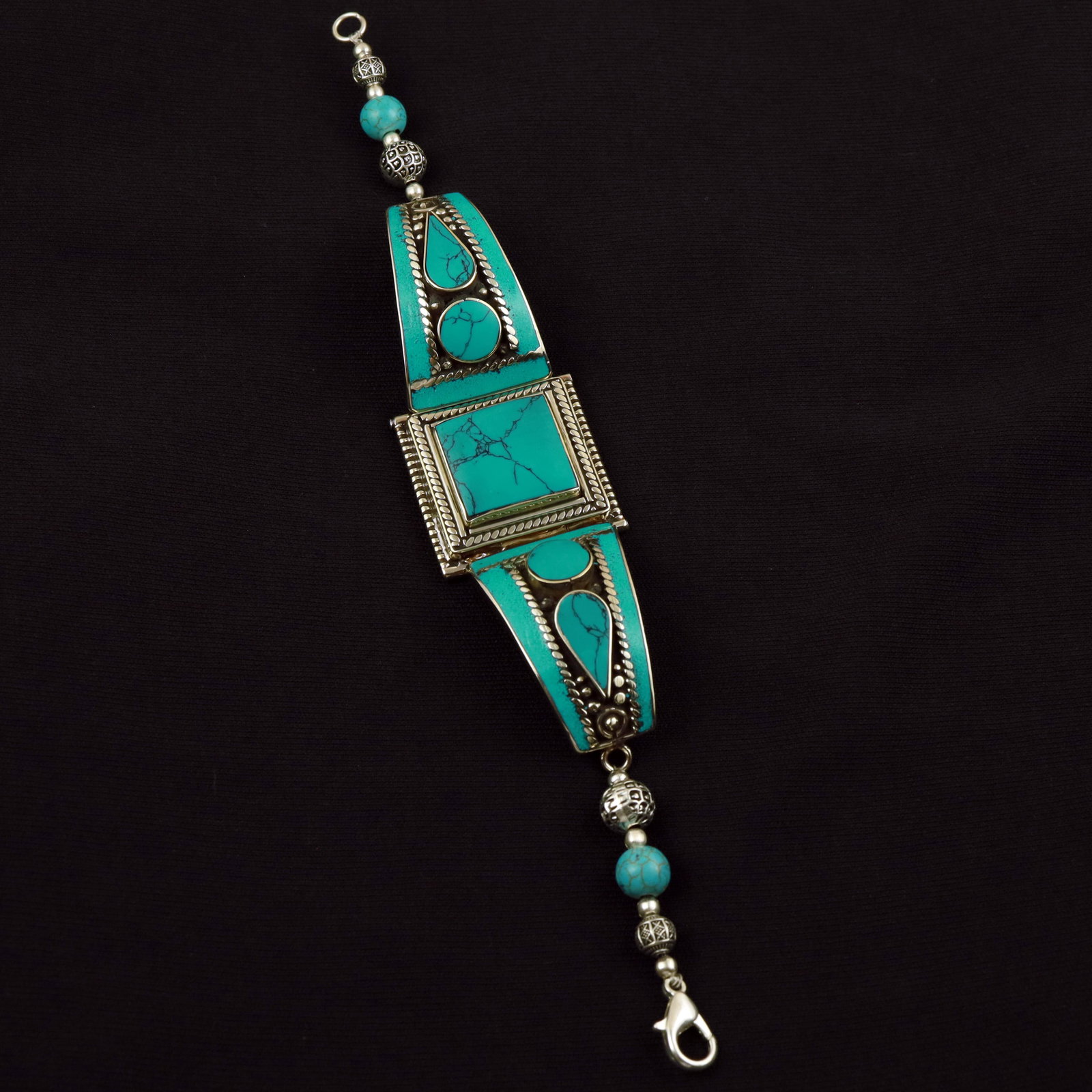 Tibetan Turquoise Handmade Ethnic Bold Bracelet: Product ID: 260512185405 Product - Tibetan Handmade Ethnic Bracelet Gemstone - Natural Turquoise Size - 7 Inch Weight - 40 Gram Approx Metal - Brass & Copper mix Metal Origin - Nepal Country/Region of
