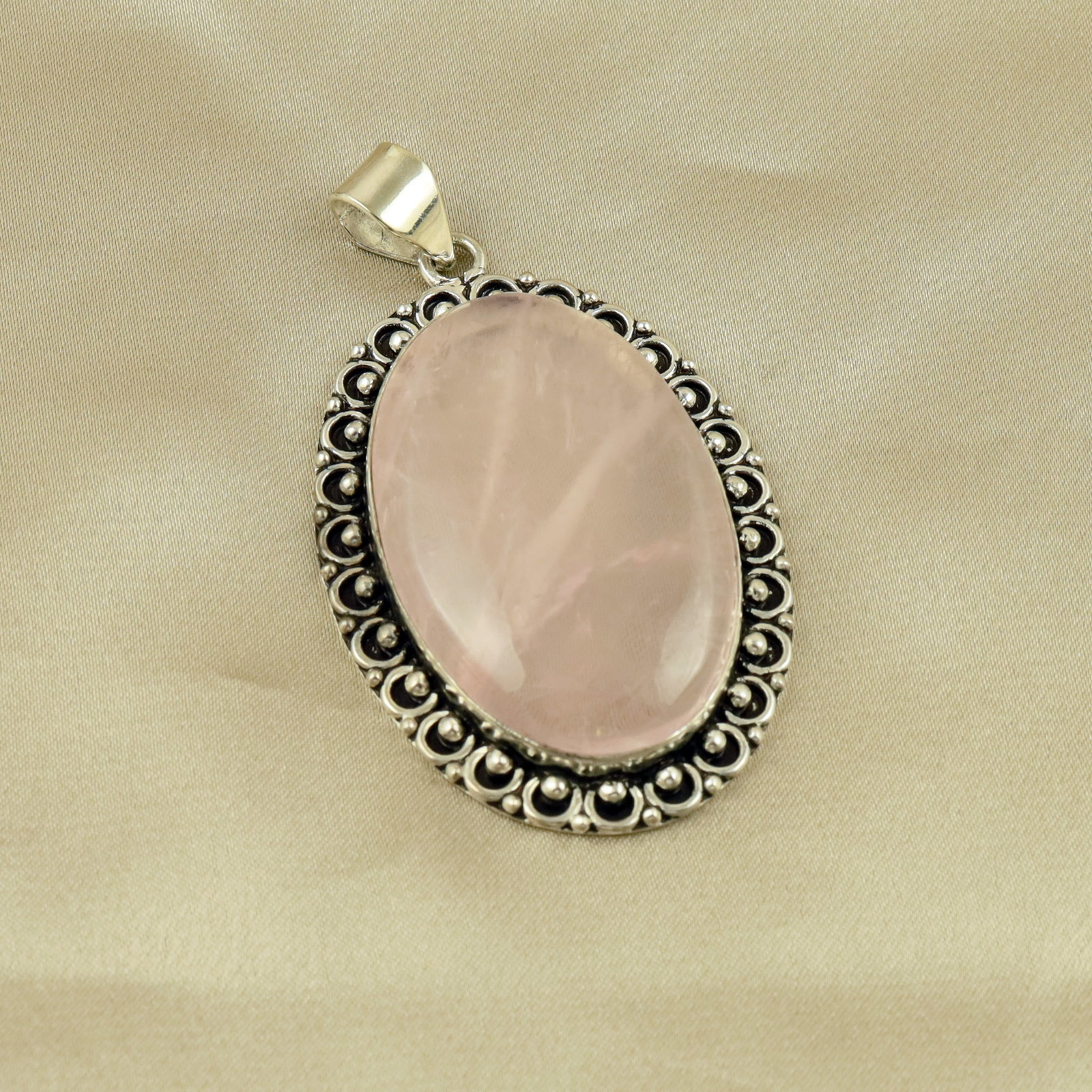 Natural Rose Quartz Sterling Silver Plated Handmade Pendant: Product ID: 260513110023 Product - Handmade Silver Plated Pendant Metal - 92.5 Sterling Silver Plated Pendant Size - 5x3.5 CM Gemstone - Rose Quartz Gemstone Origin - Brazil Gemstone Shape - Oval Pend