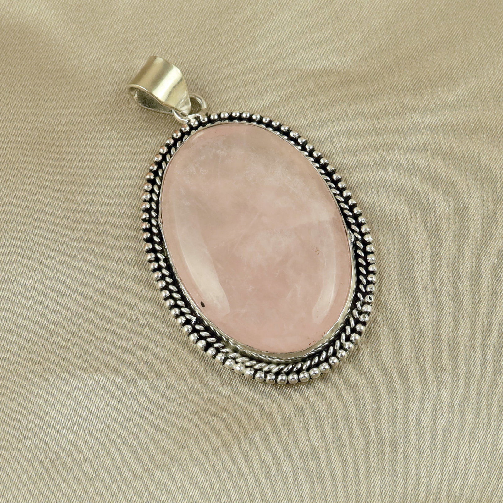 Natural Rose Quartz Sterling Silver Plated Handmade Pendant: Product ID: 260513110320 Product - Handmade Silver Plated Pendant Metal - 92.5 Sterling Silver Plated Pendant Size - 4.5x3.5 CM Gemstone - Rose Quartz Gemstone Origin - Brazil Gemstone Shape - Oval Pe
