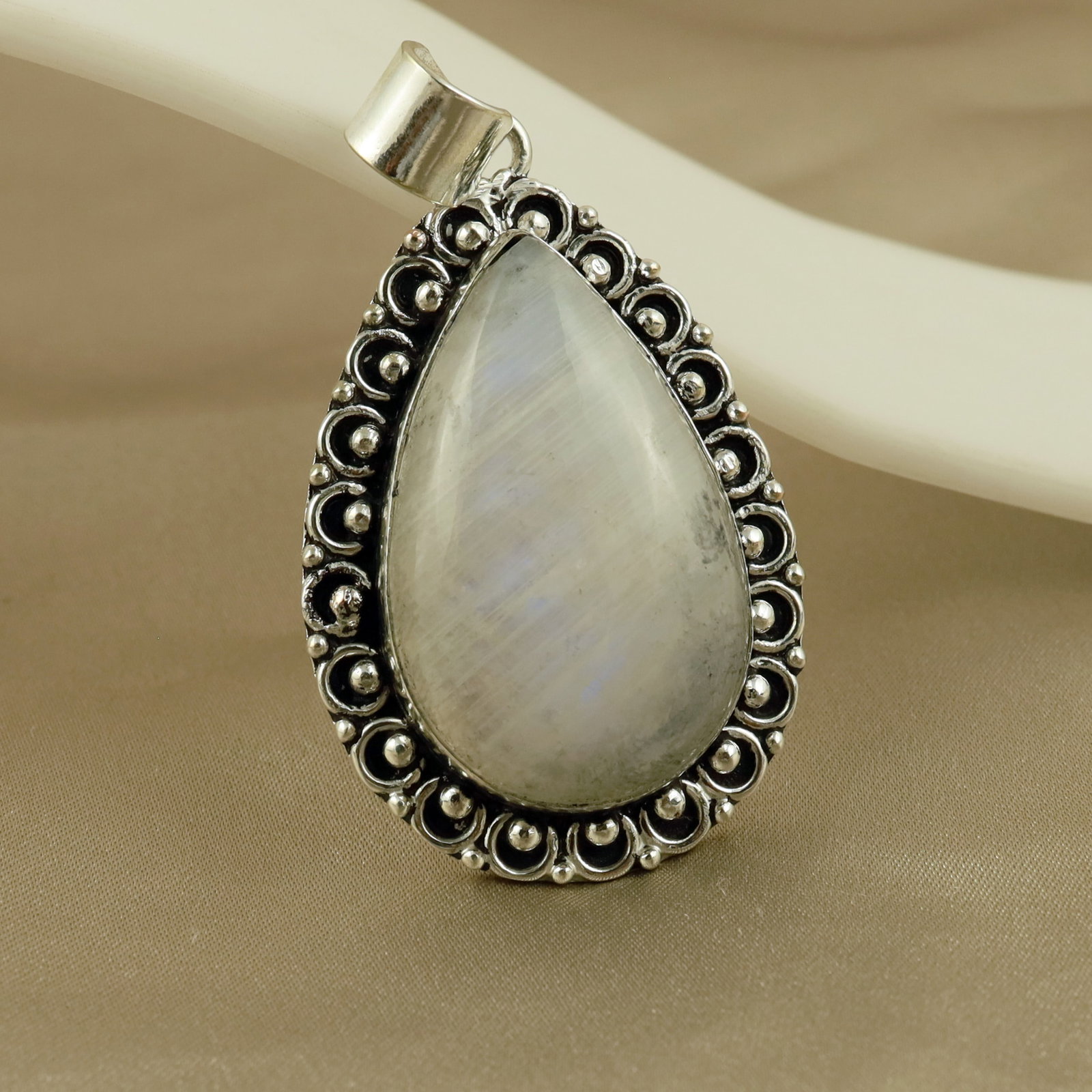 Natural Rainbow Moonstone Sterling Silver Plated Handmade Pendant: Product ID: 260513110610 Product - Handmade Silver Plated Pendant Metal - 92.5 Sterling Silver Plated Pendant Size - 4x3 CM Gemstone - Rainbow Moostone Gemstone Origin - India Gemstone Shape - Pear Pe