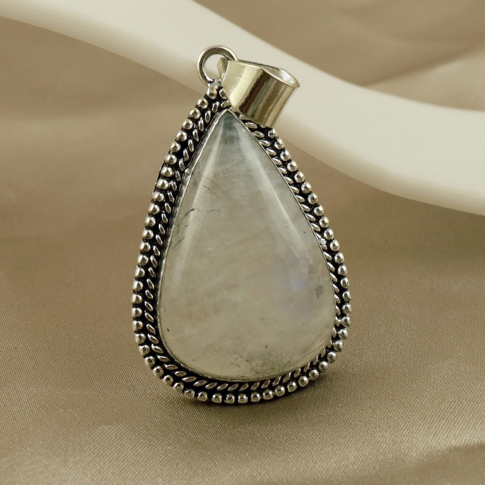 Natural Rainbow Moonstone Sterling Silver Plated Handmade Pendant: Product ID: 260513111118 Product - Handmade Silver Plated Pendant Metal - 92.5 Sterling Silver Plated Pendant Size - 4x3 CM Gemstone - Rainbow Moonstone Gemstone Origin - India Gemstone Shape - Pear P