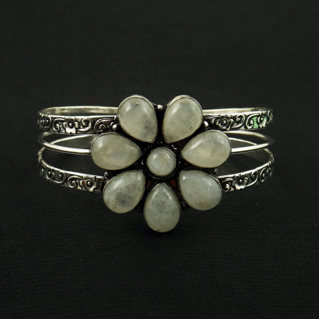Natural Rainbow Moonstone Sterling Silver Plated Handmade Cuff Bangle: Product ID: 260819180304 Product - Handmade Silver Plated Cuff Bangle Metal - 92.5 Sterling Silver Plated Bangle Size - 7x5 CM (Adjustable) Gemstone - Rainbow Moonstone Gemstone Origin - India Gemston