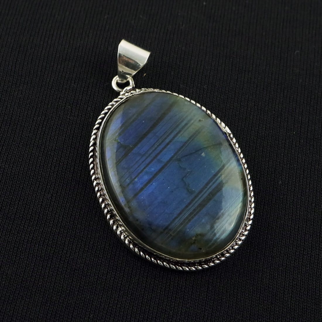 Natural Labradorite Sterling Silver Plated Handmade Pendant: Product ID: 260818143540 Product - Handmade Silver Plated Pendant Metal - 92.5 Sterling Silver Plated Gemstone - Labradorite Gemstone Origin - Canada Gemstone Shape - Oval Gemstone Size - 4X3 CM Penda