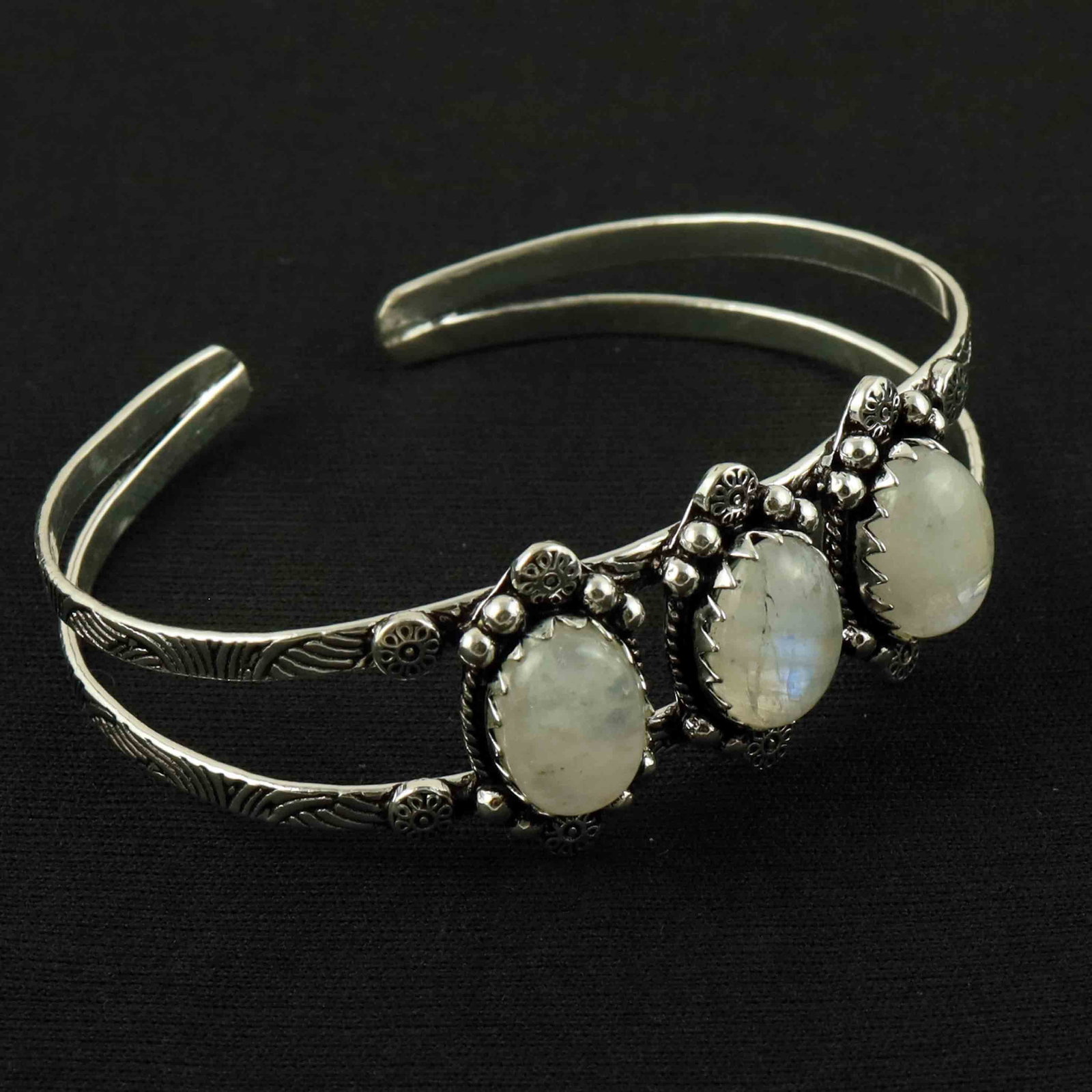 Natural Rainbow Moonstone Sterling Silver Plated Handmade Cuff Bangle: Product ID: 260528190003 Product - Handmade Silver Plated Cuff Bangle Metal - 92.5 Sterling Silver Plated Bangle Size - 7x5 CM (Adjustable) Gemstone - Rainbow Moonstone Gemstone Origin - India Gemston