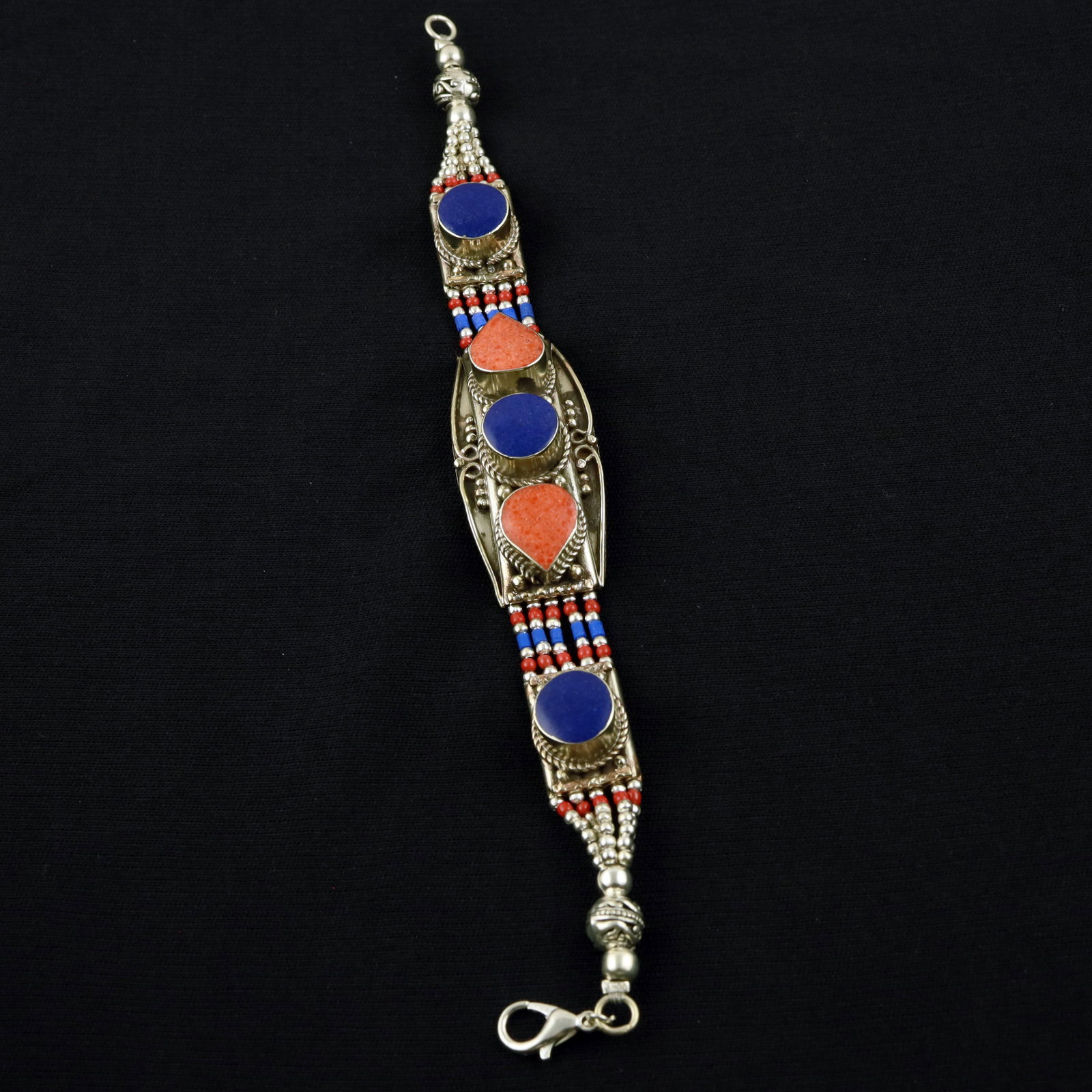Afghani Natural Lapis Lazuli & Coral Handmade Asian Bracelet: Product ID: 260520120140 Product - Tibetan Handmade Ethnic Bracelet Gemstone - Natural Lapis Lazuli & Coral Size - 7 Inch Weight - 50 Gram Approx Metal - Brass & Copper mix Metal Origin - Nepal Countr