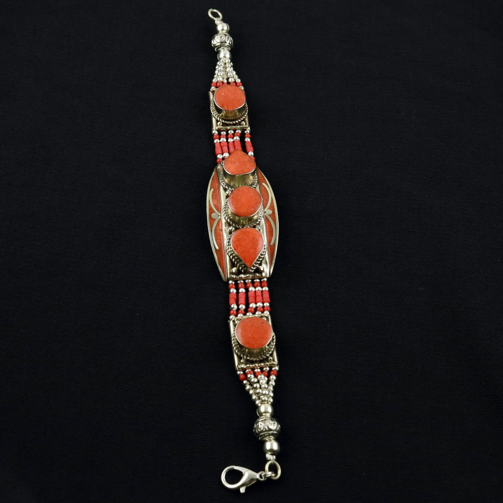 Tibetan Natural Red Coral Handmade Designer Bracelet: Product ID: 260520115444 Product - Tibetan Handmade Ethnic Bracelet Gemstone - Natural Red Coral Size - 7 Inch Weight - 50 Gram Approx Metal - Brass & Copper mix Metal Origin - Nepal Country/Region of