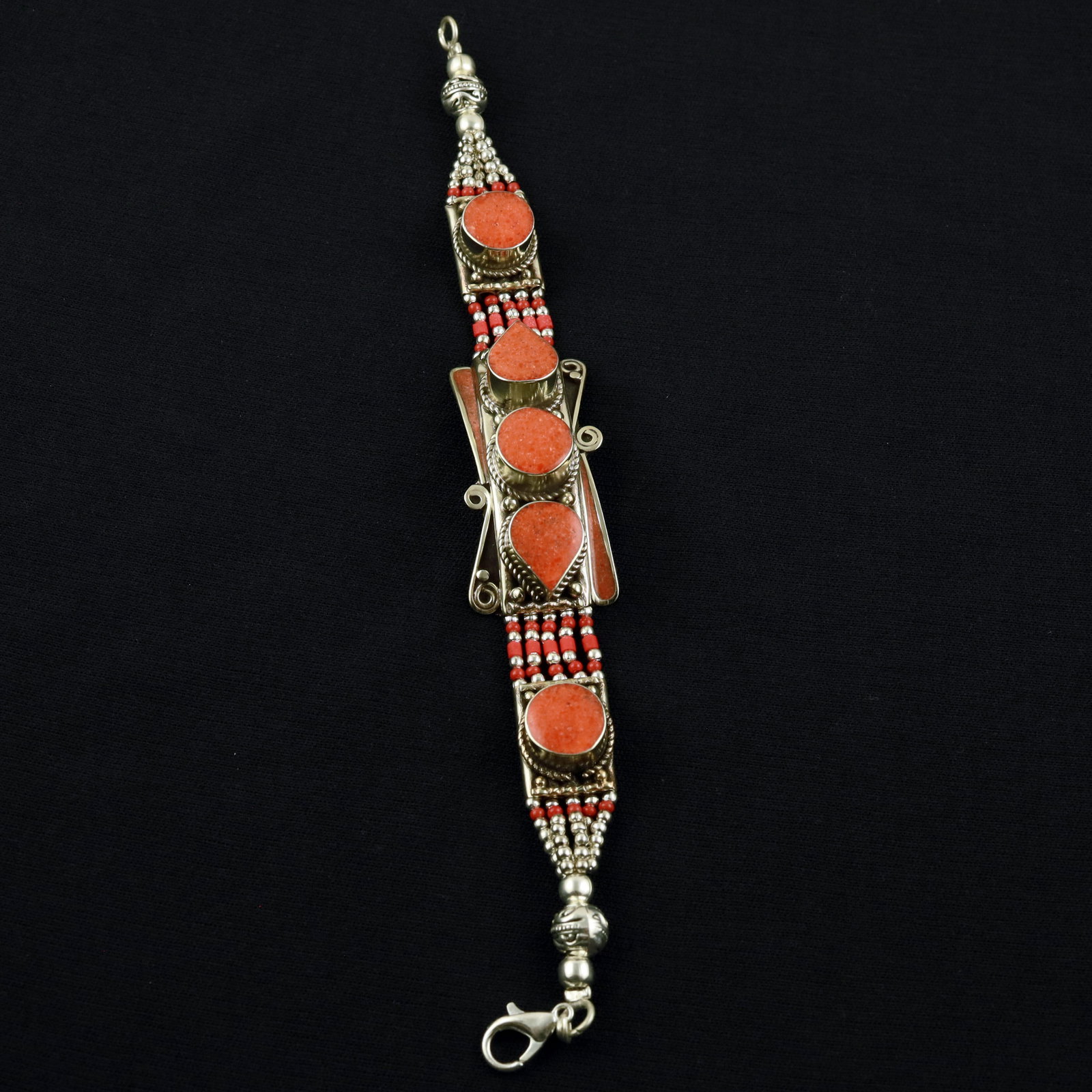 Tibetan Red Coral Handmade Ethnic Asian Bracelet: Product ID: 260520115230 Product - Tibetan Handmade Ethnic Bracelet Gemstone - Natural Red Coral Size - 7 Inch Weight - 50 Gram Approx Metal - Brass & Copper mix Metal Origin - Nepal Country/Region of