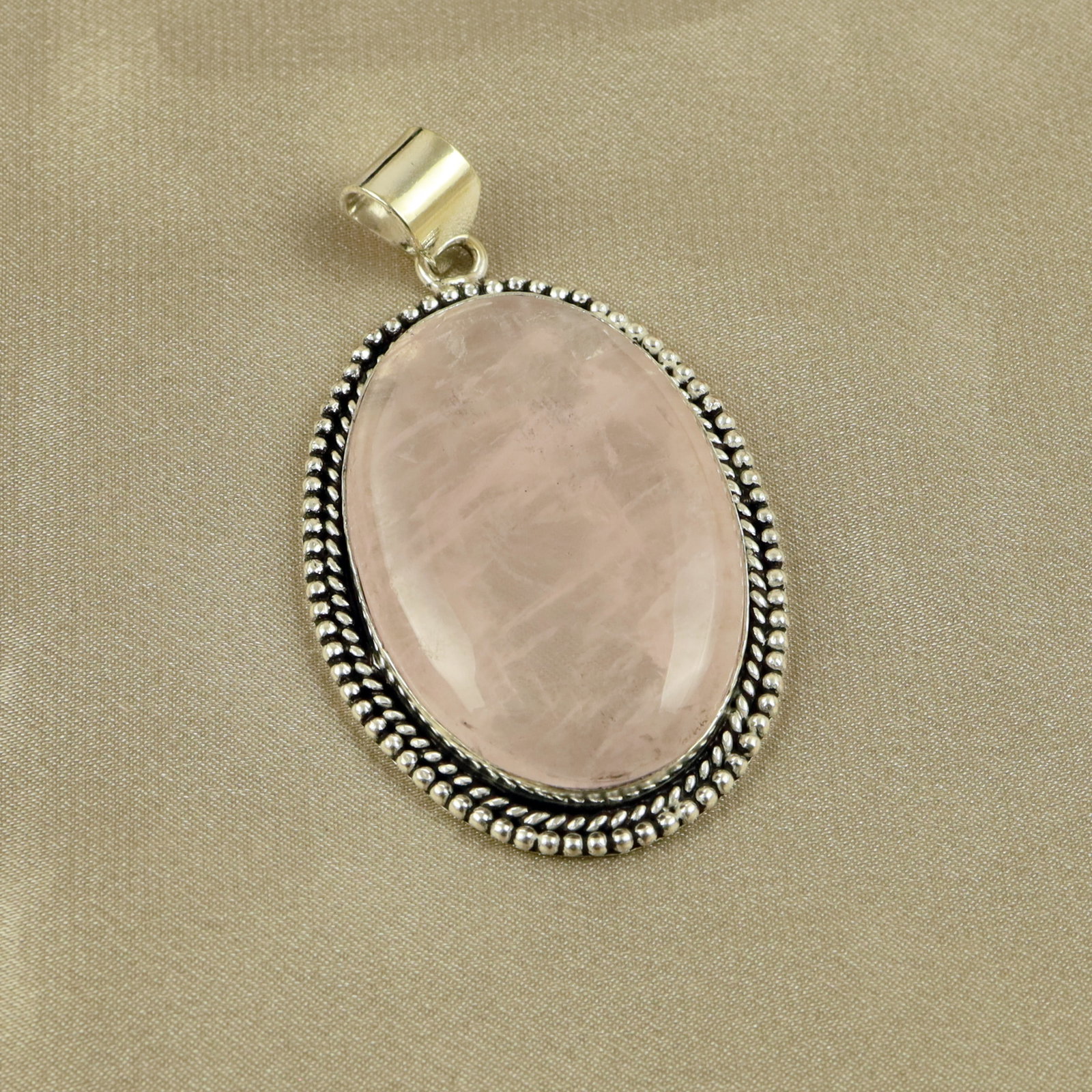 Natural A+ Rose Quartz Sterling Silver Plated Handmade Pendant: Product ID: 260518132329 Product - Handmade Silver Plated Pendant Metal - 92.5 Sterling Silver Plated Pendant Size - 4.5x3CM Gemstone - Rose Quartz Gemstone Origin - Brazil Gemstone Shape - Oval Penda
