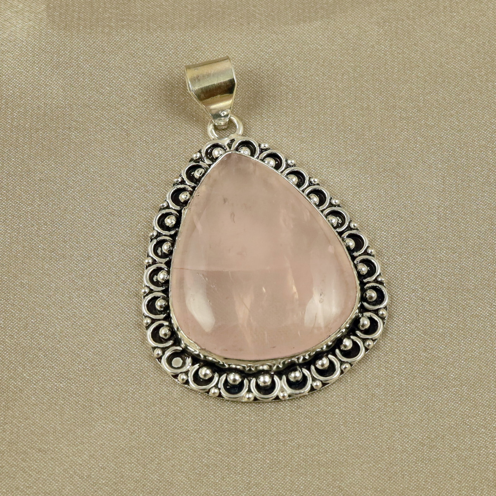 Natural Rose Quartz Sterling Silver Plated Handmade Pendant: Product ID: 260518132007 Product - Handmade Silver Plated Pendant Metal - 92.5 Sterling Silver Plated Pendant Size - 4.5x3.5CM Gemstone - Rose Quartz Gemstone Origin - Brazil Gemstone Shape - Pear Pen