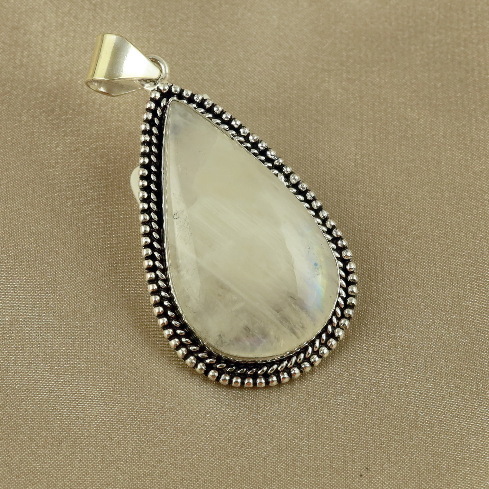 Natural Rainbow Moonstone Sterling Silver Plated Handmade Pendant: Product ID: 260517185622 Product - Handmade Silver Plated Pendant Metal - 92.5 Sterling Silver Plated Pendant Size - 4.5x2.5 CM Gemstone - Rainbow Moonstone Gemstone Origin - India Gemstone Shape - Pe