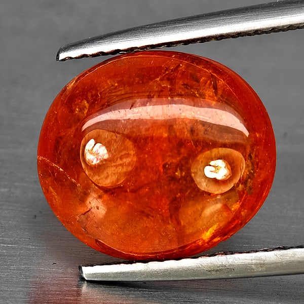 Natural Orangish Red Spessartine Garnet Gemstones 7.95 Ct. Oval Cabochon Shape 12.3 x 10.9 Mm.: Product ID: 802937984 Product Name: Natural Garnet Weight: 7.95 CT. Size: 12.3 x 10.9 x 5.8 MM. Shape: Oval Cabochon Color: Orangish Red Clarity:SI1 Luster: Good Gems Origin: Namibia Treatment: Unheat