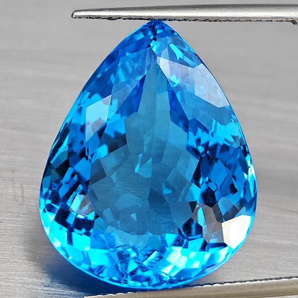 Natural Swiss Blue Topaz Gemstones 33.13 Ct. Pear Shape 22 x 17.9 Mm.: Product ID: 807168696 Product Name: Natural Blue Topaz Weight: 33.13 CT. Size: 22 x 17.9 x 10.9 MM. Shape: Pear Shape Color: Swiss Blue Clarity:VVS Luster: Good Gems Origin: Brazil Treatment: Treated 