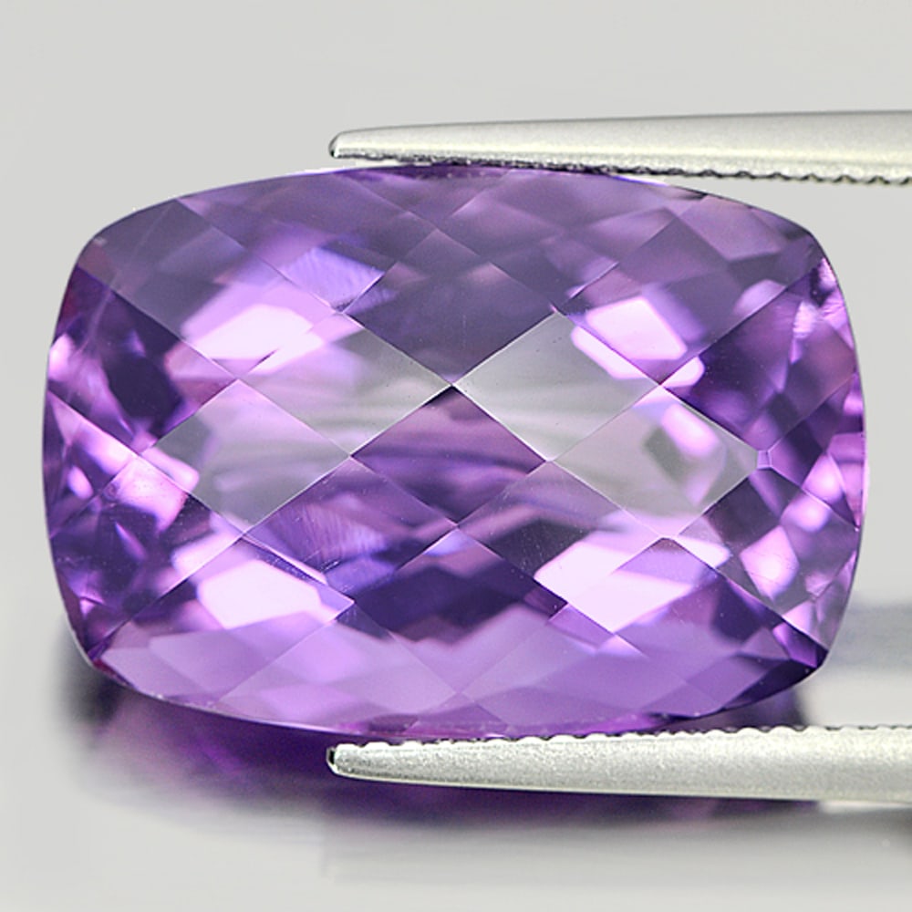 Natural Purple Amethyst Gemstones 20.15 Ct. Cushion Checkerboard Cut 21 x 14.6 Mm.: Product ID: 800320562 Product Name: Natural Amethyst Weight: 20.15 CT. Size: 21 x 14.6 x 11.1 MM. Shape: Cushion Checkerboard Color: Purple Clarity:VSI Luster: Very Good Gems Origin: Brazil Treatment: