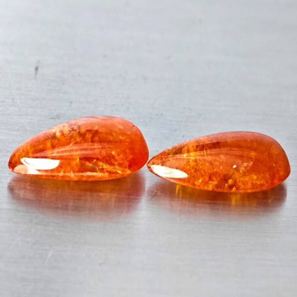 Natural Orangish Red Spessartine Garnet Gemstones 10.68 Ct. 2 Pcs. Pear Cabochon Shape 13.5 x 9 Mm.: Product ID: 802938006 Product Name: Natural Garnet Weight: 10.68 CT. Size: 13.5 x 9 x 5 MM. Shape: Pear Cabochon Color: Orangish Red Clarity:SI1 Luster: Good Gems Origin: Namibia Treatment: Unheated C