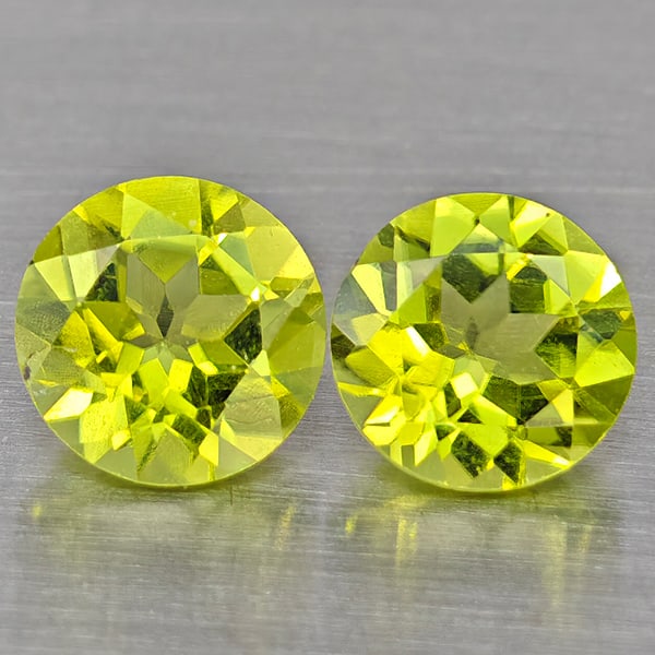 Natural Green Peridot Gemstones 1.09 Ct. 2 Pcs. Round Shape 5.3 Mm.: Product ID: 805317584 Product Name: Natural Peridot Weight: 1.09 CT. Size: 5.3 x 5.3 x 3.2 MM. Shape: Round Color: Green Clarity:VSI Luster: Good Gems Origin: Pakistan Treatment: Unheated Crystal Stru